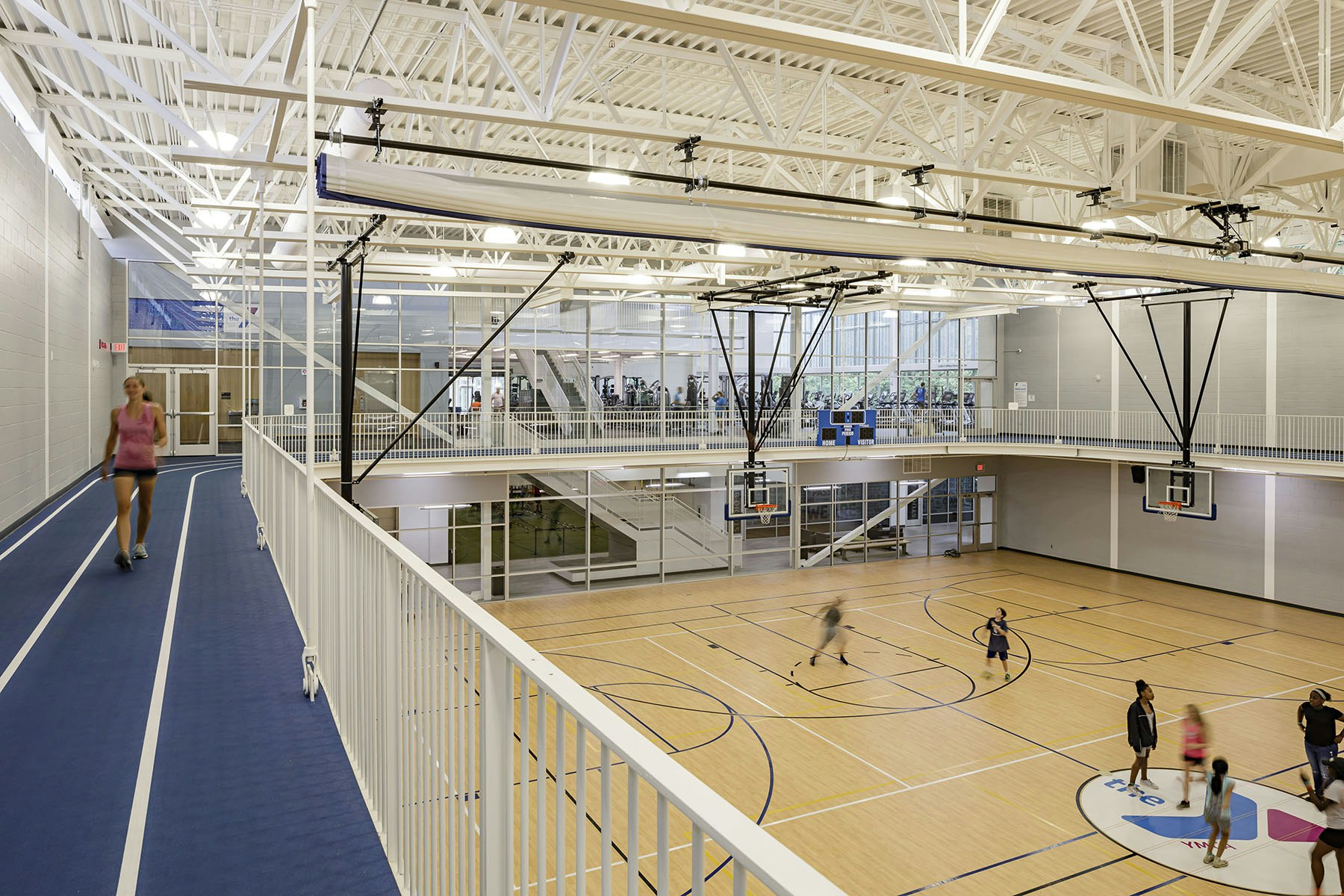 double gymnasium with multipurpose stage and elevated running track